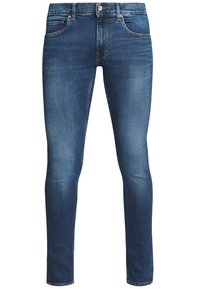Tunna blå jeans i denim, med en klassisk femfickdesign, dragkedja och ljus blekning för extra textur och detalj.