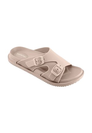 Beige open-toe slidesandaal met twee verstelbare gespsluitingen en een gestructureerde zool, ontworpen voor casual gebruik.