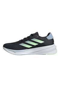 Black athletic shoe with mesh upper, featuring three light green stripes, a gray heel cap, and a white sole with textured accents.
