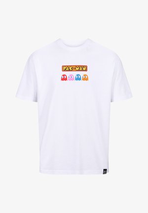 White cotton t-shirt featuring a printed "PAC-MAN" logo and four colored ghost characters (red, pink, blue, orange) on the front.