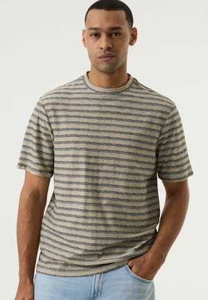 Camiseta de rayas en beige claro y azul marino, con cuello redondo y mangas cortas, fabricada en un tejido texturizado y con un corte holgado.