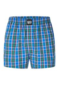 Blue plaid swim shorts with green, red, and white lines. Elastic waistband with a black logo patch. Lightweight, smooth fabric texture.