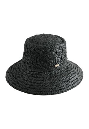 Black woven straw bucket hat with wide brim and small rectangular metal logo tag on the side.