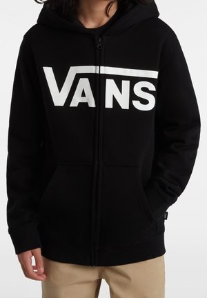 Sweatshirt à zip noir avec un grand logo blanc Vans sur la poitrine, doté d'une capuche et de poches avant, fabriqué en tissu doux.