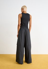 adidas Originals ZIP OFF - Treniņtērpa apakšdaļas - black