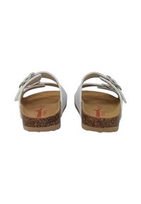 Sandali bianchi con suola in sughero, tomaia in pelle e un fiocco decorativo sul cinturino. L'interno presenta una soletta marrone chiaro.