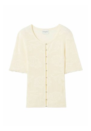 Cardigan en tricot crème à manches courtes avec un motif floral subtil et de petits boutons ronds sur le devant.