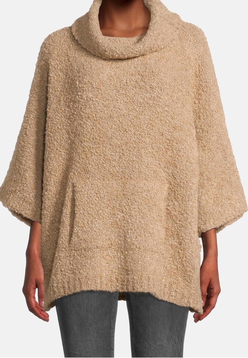 Beżowy, teksturowany poncho z kapturem, szerokimi rękawami i kieszenią z przodu; miękki materiał o luźnym kroju, dłuższy z tyłu.