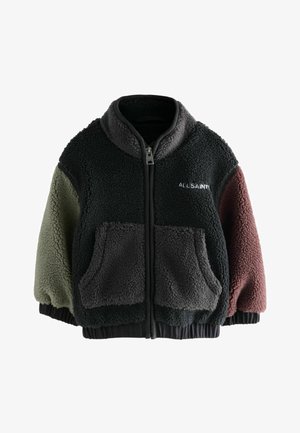 Fleecová bunda se zipem, nabízena v barvách: tmavě zelená, černá, šedá a burgundská. Dva přední kapsy; texturovaná látka s jemným zakončením.