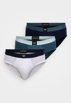 Trys apatiniai šortukai baltos, žalsvai mėlynos (teal) ir tamsiai mėlynos (navy) spalvų. Medvilnės mišinys su elastinėmis liemenėlėmis, ant kurių yra prekės ženklų etiketės. Lygus paviršius, prigludusio dizaino.