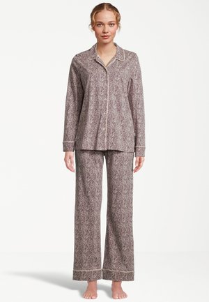 Långärmad, knäppbar pyjamas i marmor- och beige blommönster. Har kontrasterande kantband och löst sittande byxor. Mjuk tygtextur.
