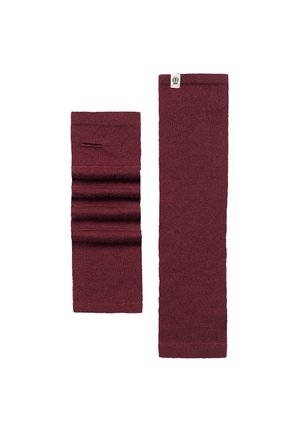 Burgundy knitted leg warmers, one with vertical folds, both with soft texture and a small logo label on the top edge, designed for warmth.