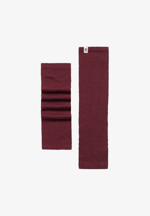 Burgundy knitted leg warmers, one with vertical folds, both with soft texture and a small logo label on the top edge, designed for warmth.
