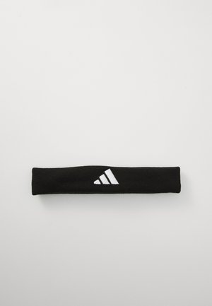 Musta hiuspanta, joka on valmistettu tekstuurikankaasta ja jossa on valkoinen Adidas-logo kolmen raidan kera yhdellä puolella. Pituus on noin 25 cm.