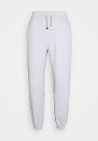 Ljusgrå mjukisbyxor i mjukt tyg, med elastisk midja med dragsnören, ribbade muddar och sidofickor.