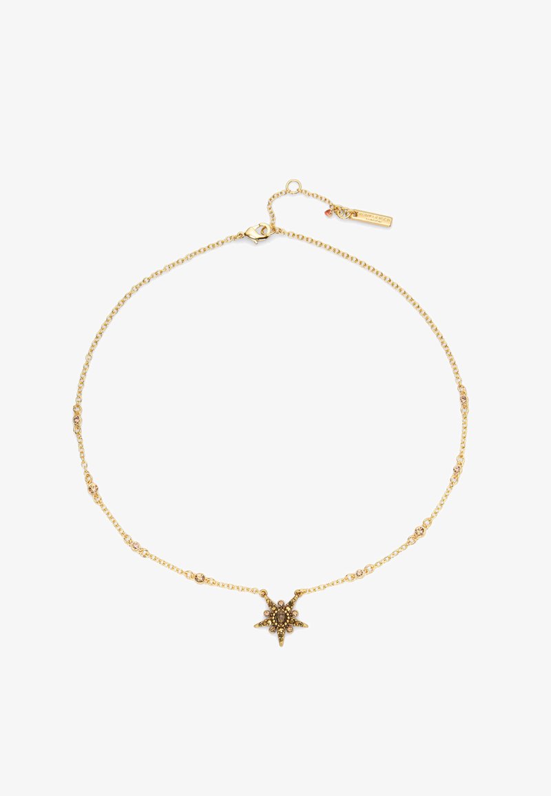 Złocona naszyjnik z zawieszką w kształcie gwiazdy z ozdobami, delikatnym łańcuchem z małymi dekoracyjnymi ogniwami oraz zapięciem na karabińczyk.