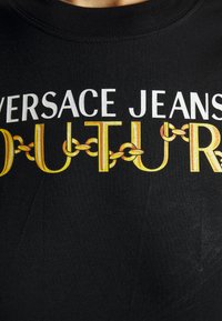 Versace Jeans Couture ORGANIC - T-shirt med print - black/gold