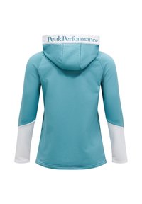 Modrá mikina s kapucňou a bielym logom Peak Performance na chrbte, dlhé rukávy a biele akcenty na manžetách, vyrobená z hladkého materiálu.