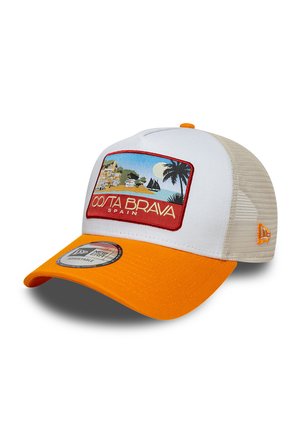 White and beige mesh trucker cap with orange brim and "Costa Brava Spain" patch showing coastal scene with palm tree and sailboats.