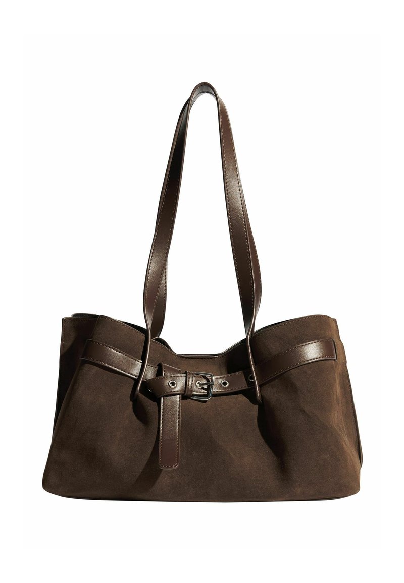 Pruun nahast kott tumepruunide nahkrihmade ja hõbedase dampidetailiga. Üksikasjalik disain avara sisemusega ja siledast tekstuurist.
