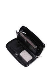 Black leather wallet with a zippered closure. Interior features card slots, a coin compartment, and a polka dot pattern on lining.