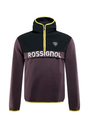 Lila Fleece-Pullover mit schwarzem oberen Teil, gelbem Reißverschluss und in Weiß aufgedrucktem "ROSSIGNOL". Mit hohem Kragen und langen Ärmeln.