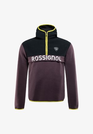 Lila Fleece-Pullover mit schwarzem oberen Teil, gelbem Reißverschluss und in Weiß aufgedrucktem "ROSSIGNOL". Mit hohem Kragen und langen Ärmeln.