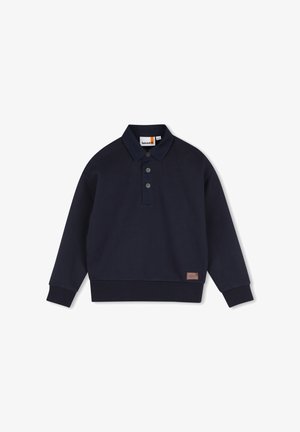 Marineblauw poloshirt met lange mouwen, geribde boorden en zoom, drie knopen op de voorkant en een klein bruin label vlak bij de zoom.