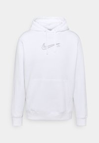 Vit huvtröja i bomullsblandning. Har en framficka, snören och en subtil grå Nike-logga på bröstet. Mjuk textur.