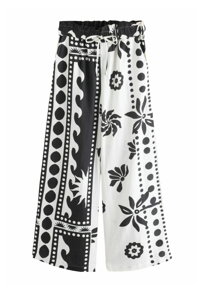 Pantalones de pierna ancha en tejido blanco y negro con estampados florales y de puntos, cinturilla elástica con cordón para un ajuste ajustable.