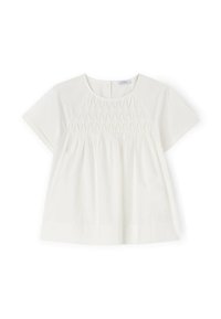 Top blanco de manga corta con escote redondo, que presenta detalles de fruncido y un corte amplio, confeccionado en tejido ligero.