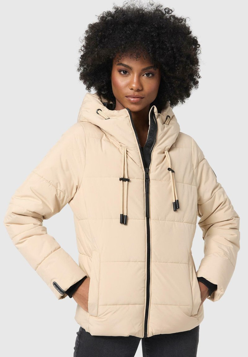 Beige puffer jacket with a hood, featuring quilted design, black zipper, adjustable drawstrings, and side pockets. Smooth, textured surface.