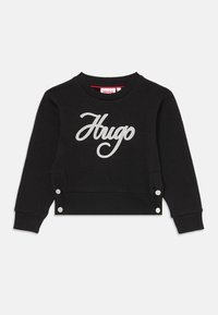 Felpa in cotone nera con logo "Hugo" ricamato in grigio, collo a costine e dettagli con bottoni a pressione all'orlo laterale.