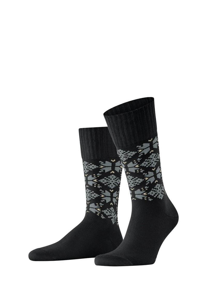 Schwarze Socken mit geripptem Oberteil und einem gepunkteten Design, das graue und hellgoldene geometrische Formen zeigt. Weicher Stoff; Knöchelhöhe.