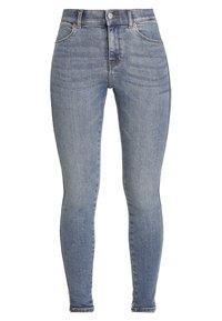 Högmidjade skinny jeans i ljusblå denim. Funktioner fem fickor, framknäppning och subtila urtvättningar över tyget.