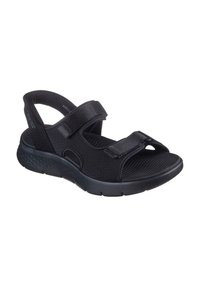 Sandalo nero con cinturini regolabili in Velcro, tomaia traforata, suola imbottita e plantare sagomato. Design leggero e traspirante.