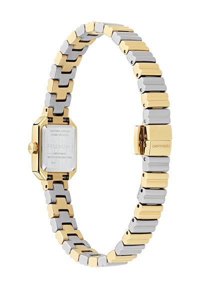 Taisnstūra pulkstenis ar sudraba nerūsējošā tērauda korpusu un zelta toņu akcentiem, aprīkots ar rotējošu rokassprādzi ar pārmaiņus sudraba un zelta sekcijām.