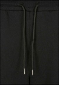 Urban Classics Donji dijelovi trenirke - black