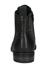 Schwarze Leder-Ankle Boots mit glatter Textur, ausgestattet mit einem seitlichen Reißverschluss, einer Ziehschlaufe und einem niedrigen, gestapelten Absatz. Dezenter Logodetail auf der Rückseite.