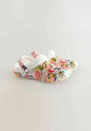Colorful floral printed clogs with a white fur lining. Features a slip-on design and rear strap for secure fit. Made from durable material.