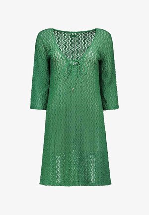 Robe en dentelle verte avec manches trois-quarts, encolure en V et détail noué à l'avant, présentant un motif ajouré ondulé sur toute la surface.