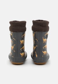Bottes imperméables grises avec un motif de dinosaure orange, dotées d'un revers texturé marron et d'une semelle en caoutchouc.