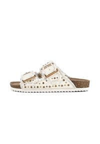 White sandal with two buckle straps, decorative studs, frayed edges, and a textured cork footbed; serrated white outsole for grip.