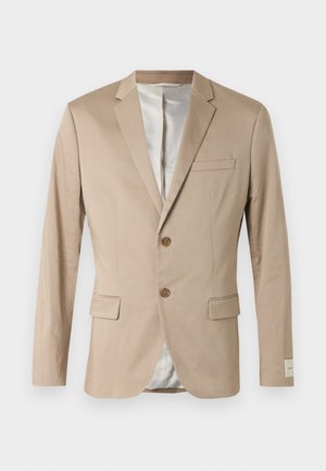 Beige two-button men's blazer with notch lapel, flap pockets, chest pocket, and light gray suit lining on a white background.