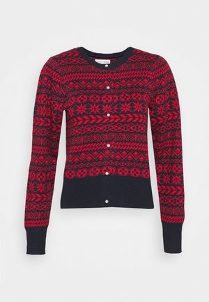 Gilet boutonné à motifs rouges et noirs avec des dessins géométriques et flocons de neige, poignets et ourlet côtelés.