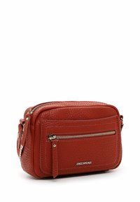 Textured red leather crossbody bag with dual zippered compartments and a front pocket. Features a brand name tag and adjustable strap.