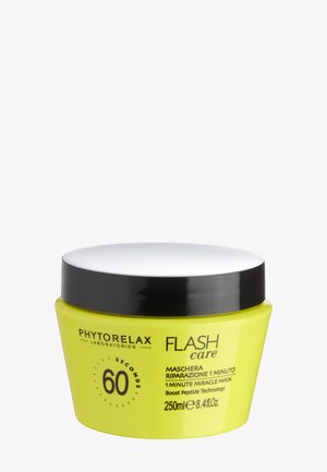 Gul krukke med Phytorelax Flash Care 1 Minute Miracle Mask med sort låg, 250 ml, med teksten Boost Peptide Technology.