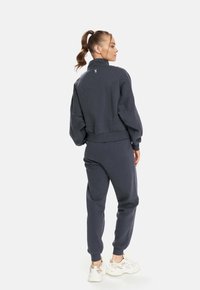 Cardio Bunny SLOW  - Tracksuit bottoms - grey