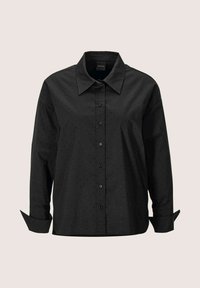 Schwarze Button-up-Hemd mit kragenförmigem Ausschnitt, ausgestattet mit einem strukturierten Muster aus kleinen Punkten und langen Ärmeln mit hochgerollten Manschetten.