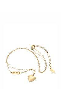 Bracciale delicato in oro con charm a forma di cuore, chiusura a moschettone e catena di estensione regolabile su sfondo bianco.